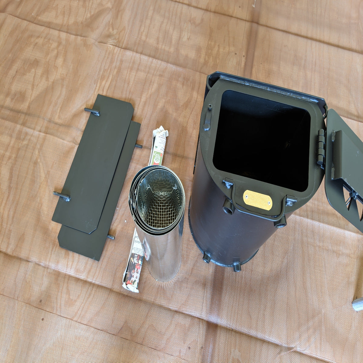 All the parts for a small camping stove for heat , cooking, and comfort